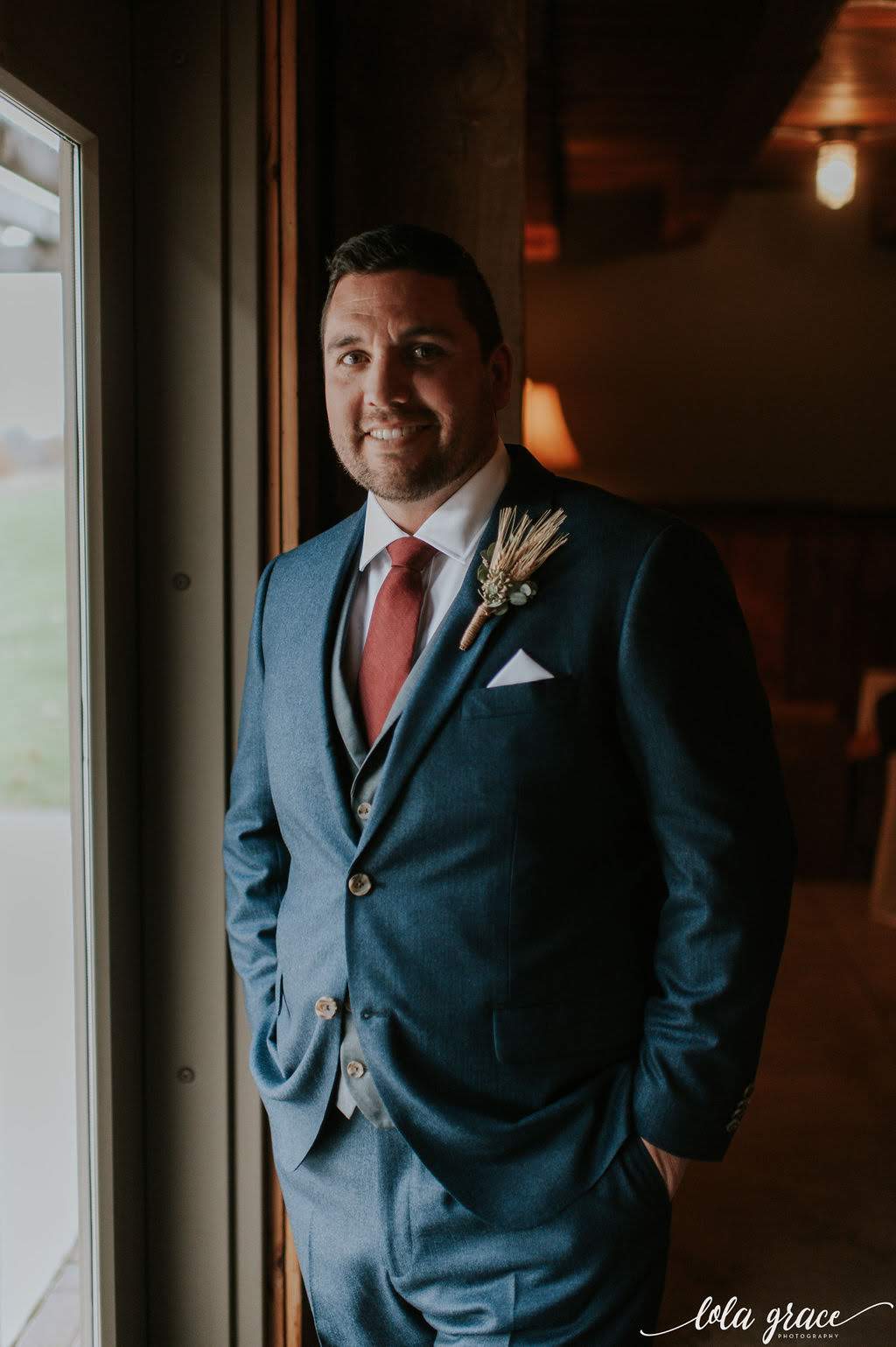 The perfect fall suit and boutonniere combo for this handsome groom.
