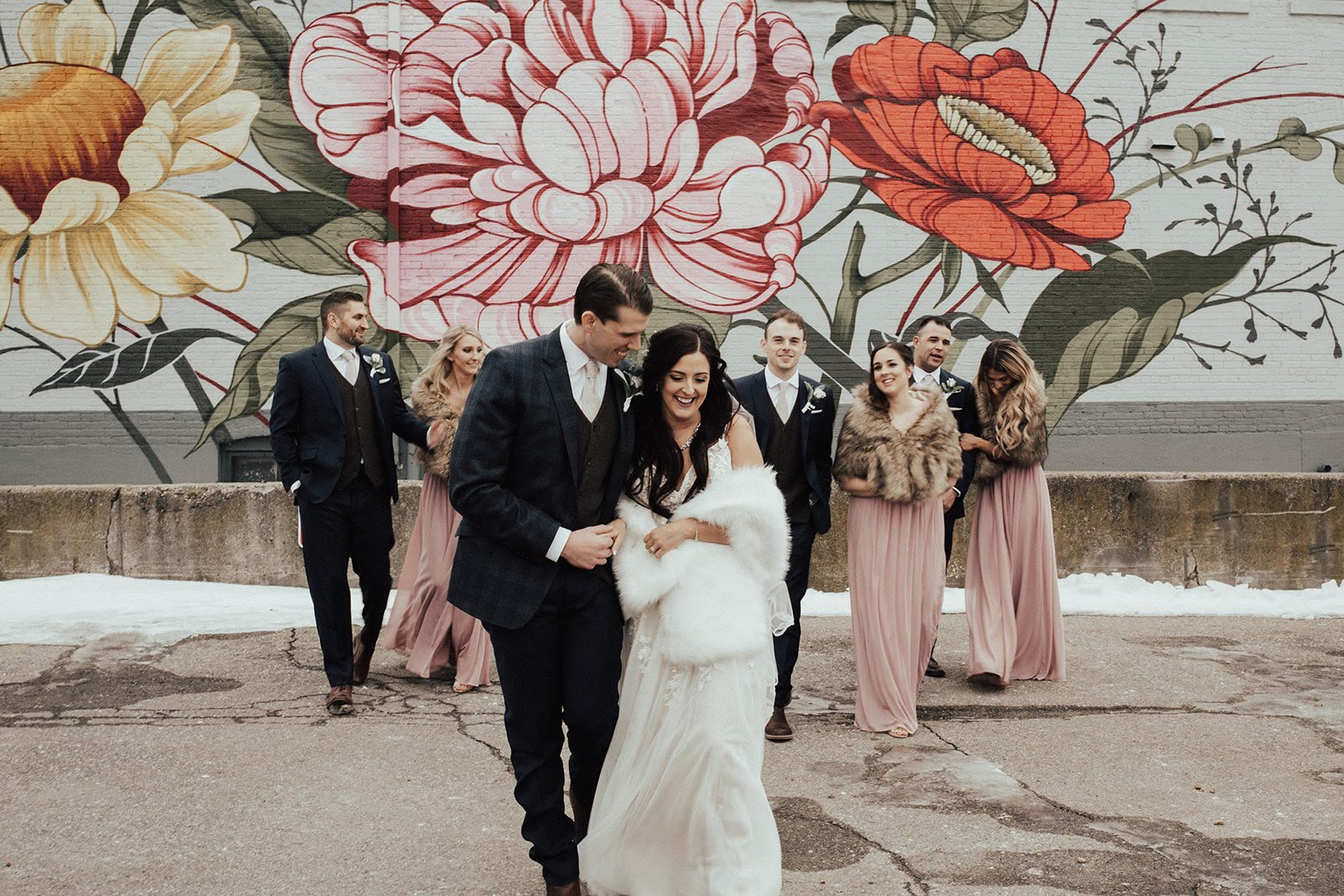 Murals in downtown Jackson provided such a backdrop for their bridal party pictures.