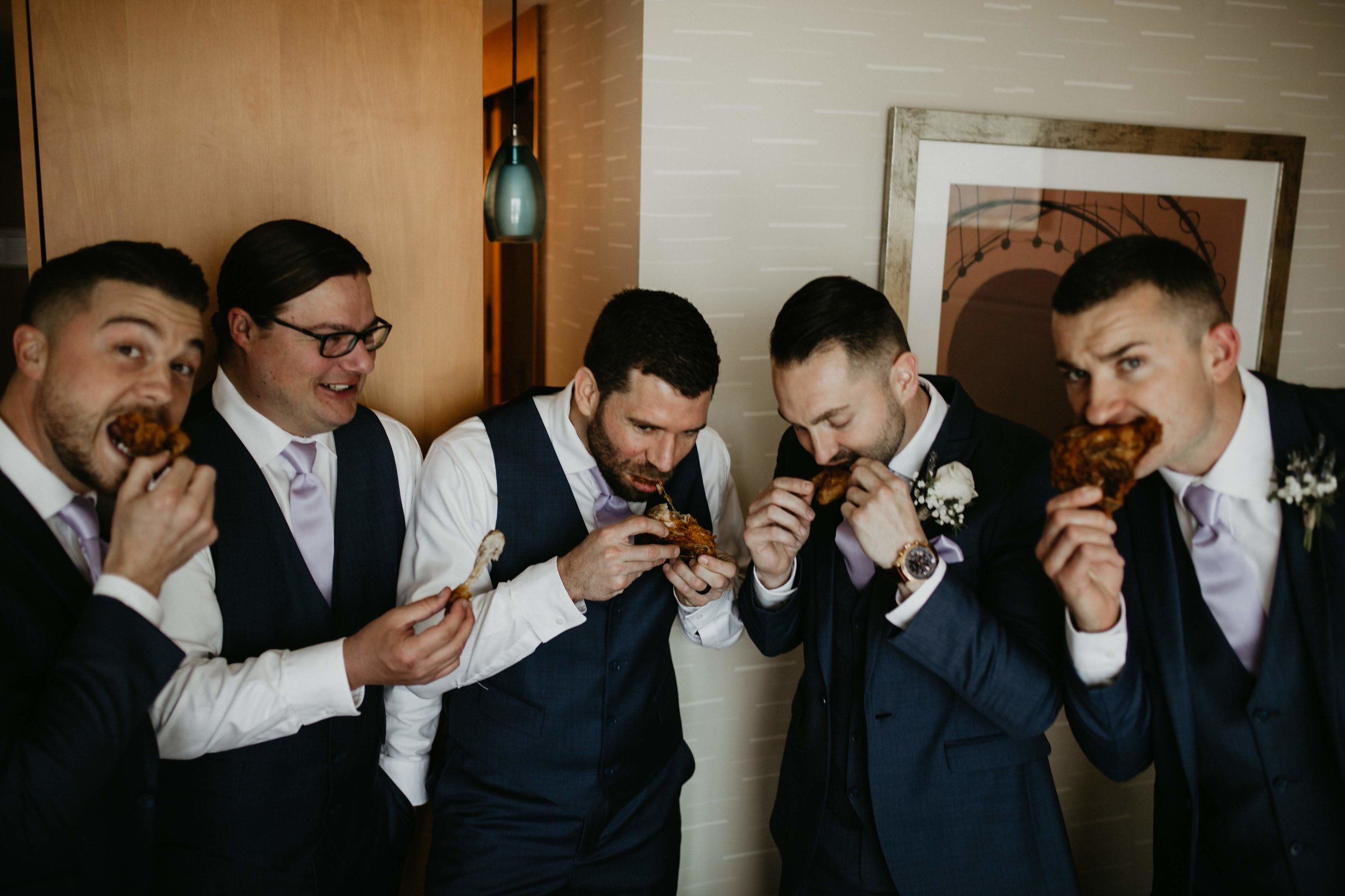 Sustenance is key on your wedding day, probably the most stylish they have ever looked eating wings!
