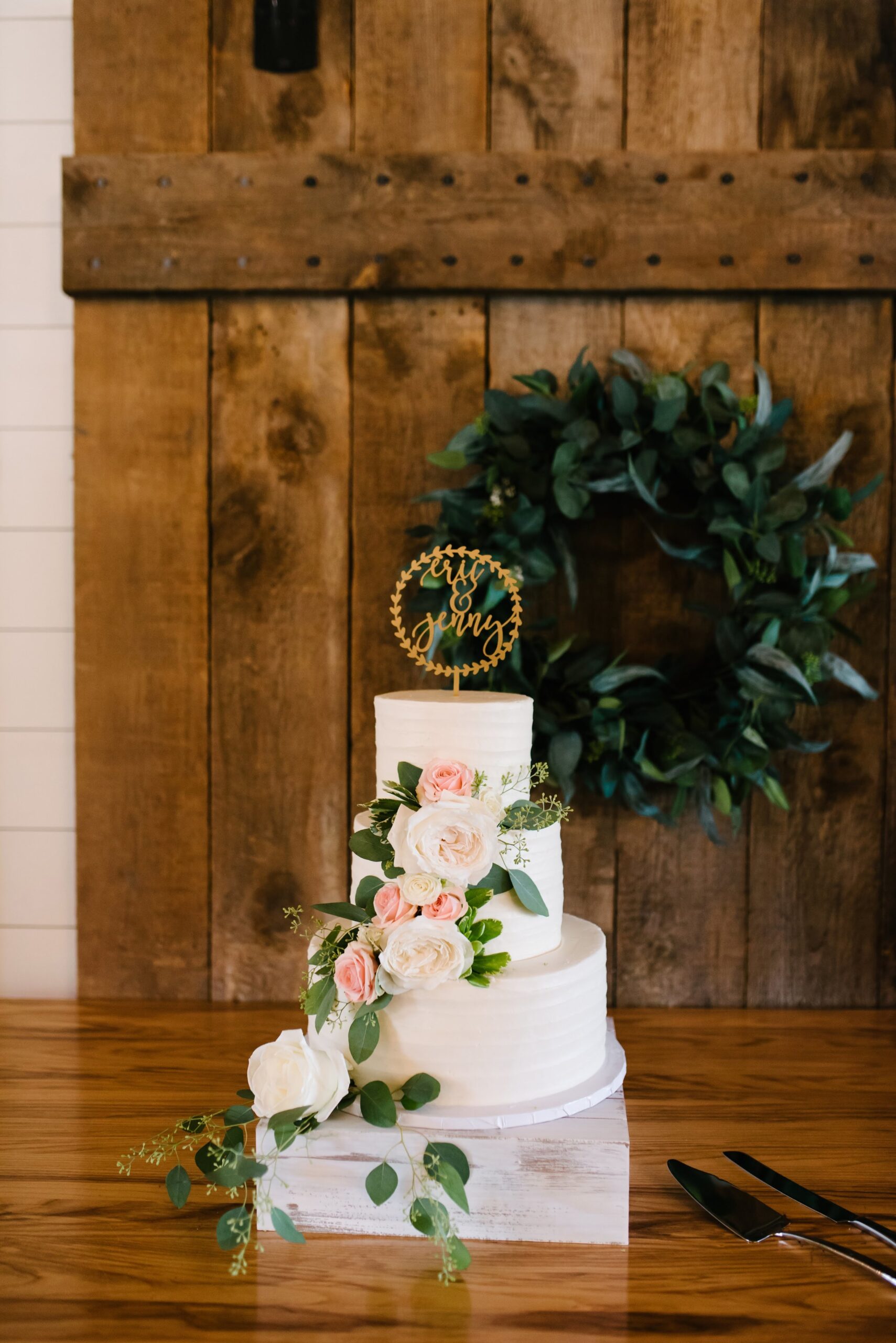 Clean and simple cake with just the right floral embellishments to make their wedding look.