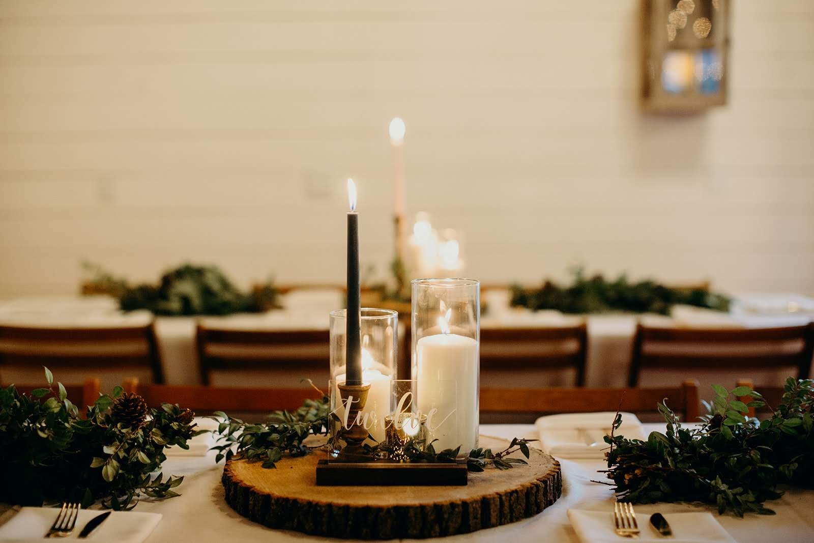 The greenery garlands created a lush look on the tables with glowing candlelight.