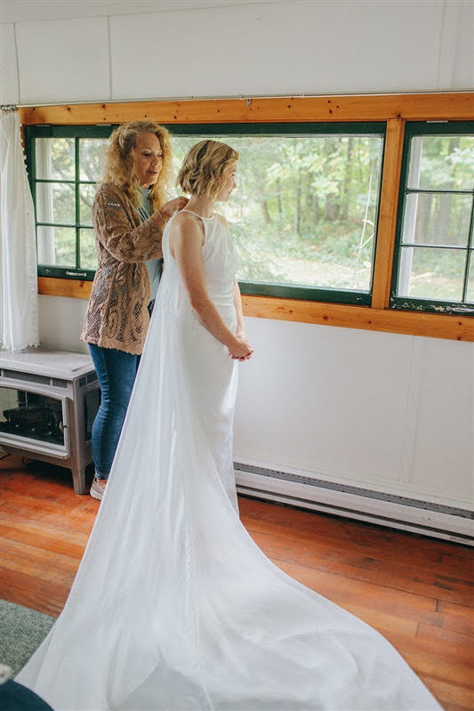 Bride and her mom getting ready on her wedding day at Cherry Basket Farm. 