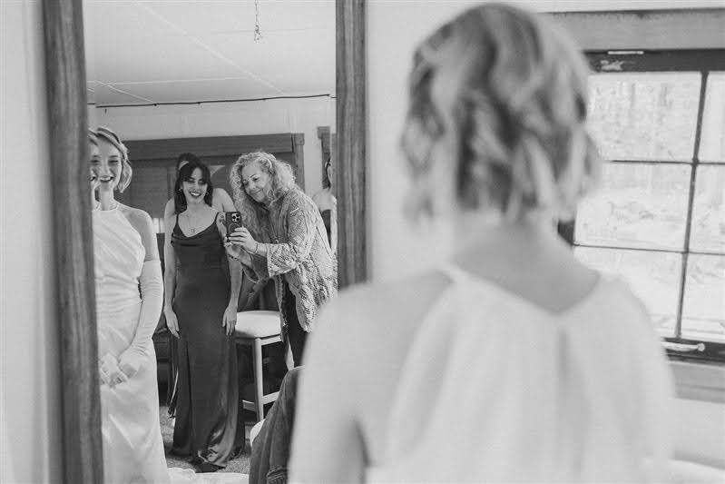 Bride getting ready on wedding day at Cherry Basket Farm. 