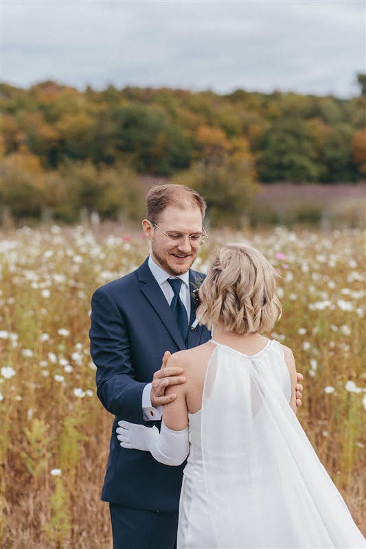 Bride and groom reacting to each other after their first look on their wedding day at Cherry Basket Farm. 
